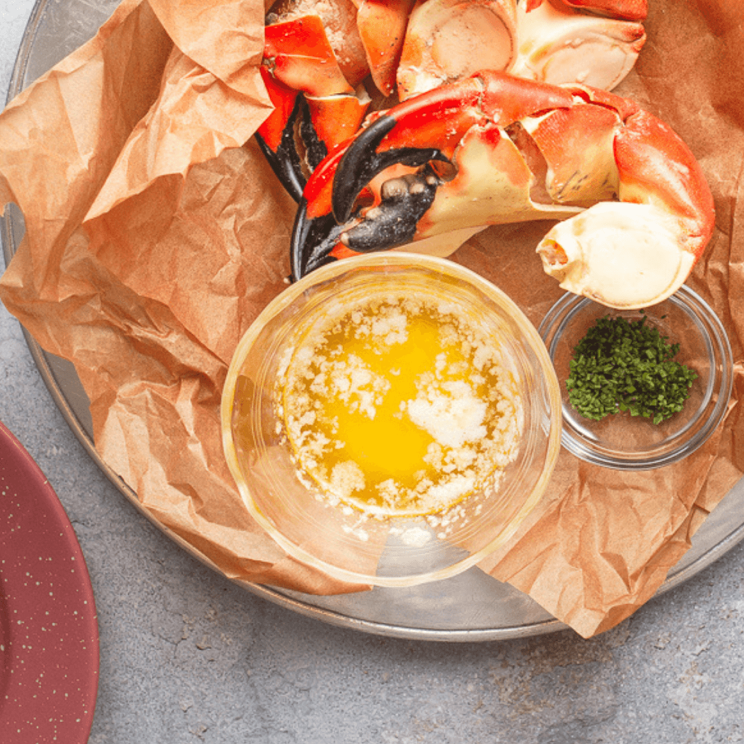 Stone crab claws served with melted butter and herbs