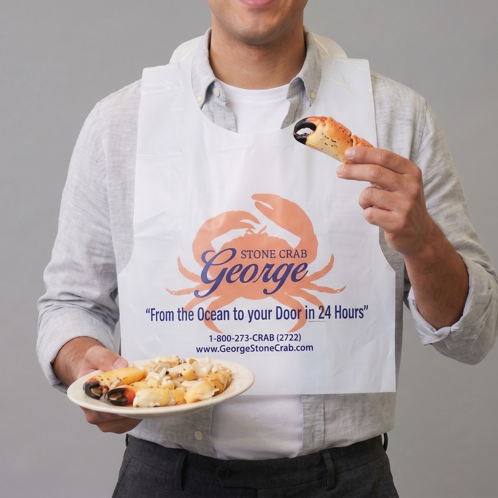 Image of Complimentary George Stone Crab Bib Pack (Set of 2) - Man wearing a George Stone Crab bib